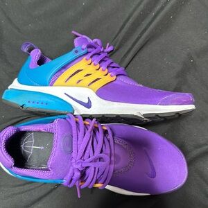 I am selling Nike prestos they are blue purple and yellow and size 8 in men